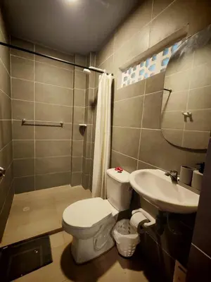 a bathroom with a toilet and a sink at Tata Lolo in Coveñas