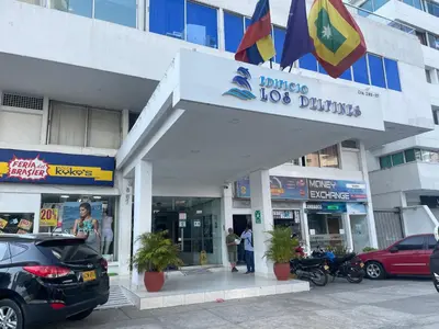 a store with motorcycles parked in front of it at Delfin 207 in Cartagena de Indias