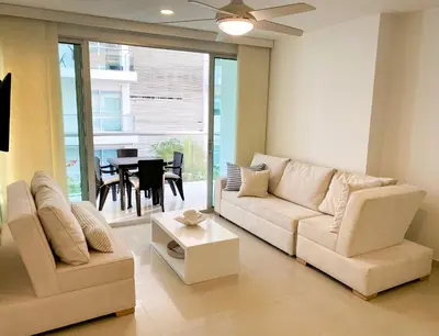 a living room with a couch and a table at Vista al mar en Cartagena , Apartamento en Morros in Cartagena de Indias