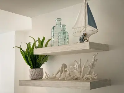 a shelf with a glass bottle and a ship on it at Vista al mar en Cartagena , Apartamento en Morros in Cartagena de Indias