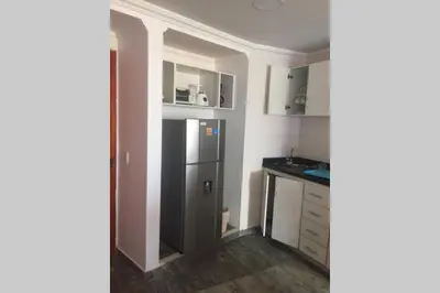 a kitchen with a stainless steel refrigerator and cabinets at Cartagena de Indias, Mar, historia y diversión ! in Cartagena de Indias