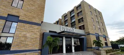 a building with a sign on the front of it at LivinnX Barranquilla in Barranquilla