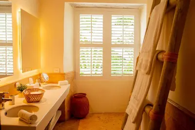 a bathroom with a sink and a window at Casa Diluca Cartagena Hotel Boutique in Cartagena de Indias