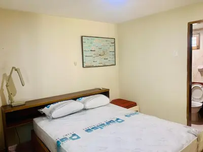 a bedroom with a bed with two white pillows at Santa Marta Bello Horizonte - Cabañas Don Rafa in Santa Marta