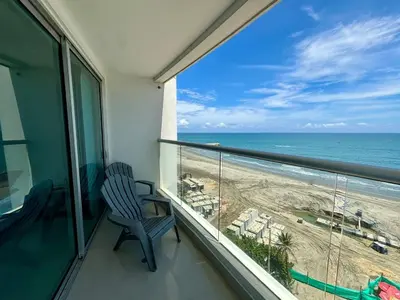 a balcony with a view of the beach at Playa Cartagena Apartments in Cartagena de Indias