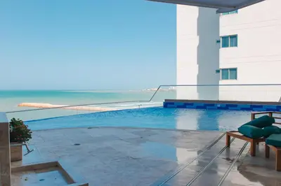 a view of the ocean from the balcony of a hotel at Playa Cartagena Apartments in Cartagena de Indias