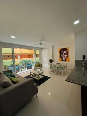 a living room with a couch and a table at Hermoso apartamento en la mejor zona de la ciudad in Cartagena de Indias
