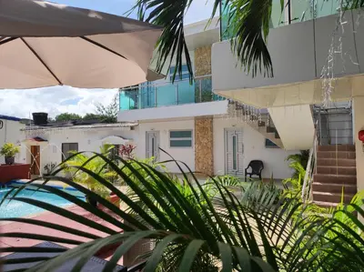 a view of the house from the courtyard at Apartamentos Villa Leonor in Coveñas