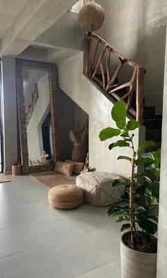 a living room with a mirror and a plant at Sea La Vie in San Bernardo del Viento