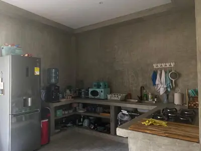 a kitchen with a stainless steel refrigerator and a counter at Sea La Vie in San Bernardo del Viento