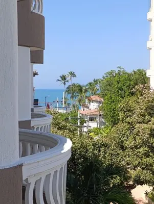 a balcony of a building with a view of the ocean at Amplio dúplex con playa y mall a una cuadra in Santa Marta