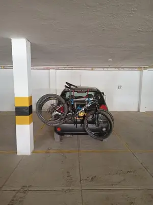 a bike is parked in a parking garage at Amplio dúplex con playa y mall a una cuadra in Santa Marta
