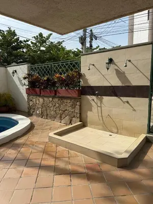 a bathroom with a shower and a tub in a yard at A metros de las playas de Bello Horizonte y de Centro Comercial Zazue in Santa Marta