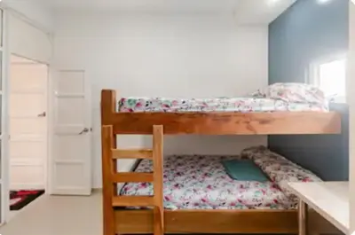 a bedroom with a bunk bed with a ladder at Casa con Piscina Privada Playas del Mar in Cartagena de Indias