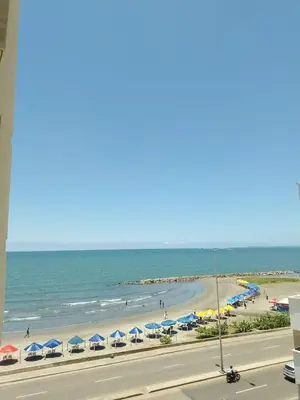 a view of a beach with umbrellas and the ocean at Apartamento mar in Cartagena de Indias