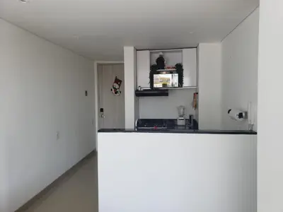a kitchen with white walls and a counter top at Apto- Condominio H Sonesta - Morros-salida a la playa - cerca Hotel Americas in Cartagena de Indias
