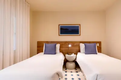two beds sitting next to each other in a room at B Haus Hotel Boutique in Cartagena de Indias