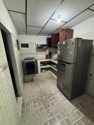 a kitchen with a stainless steel refrigerator in a room at Apartamentos San Felipe in Cartagena de Indias