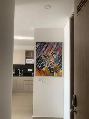 a painting hanging on a wall in a kitchen at 19TH FLOOR LUXURY APARTMENT BAY VIEW CARTAGENA in Cartagena de Indias