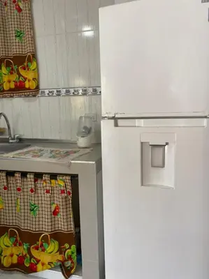a white refrigerator in a kitchen next to a sink at En mi casa cartagena in Cartagena de Indias