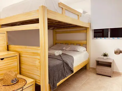 a bedroom with a bunk bed in a room at Apartamento Exclusivo - Caribe Campestre Coveñas in Coveñas