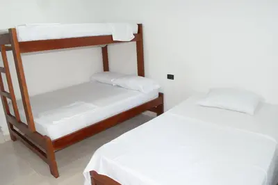 two bunk beds in a room with white walls at ZABDI COVEÑAS in Coveñas