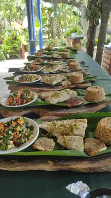 a row of plates of food on a table at Hostal Campomar in Santa Veronica