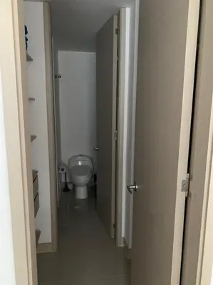 a hallway to a bathroom with a toilet in it at Edificio kuali apto 1704 in Santa Marta