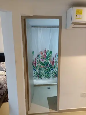 a glass door with a window with plants on it at Apartaestudio Altamar in Cartagena de Indias