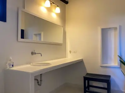 a bathroom with a sink and a mirror at Casa Ines in Santa Marta