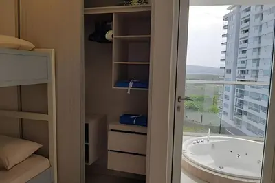 a bathroom with a bath tub and a window at 2 Dormitorios Jacuzzi y Vista Mar. Frente a playa in Cartagena de Indias