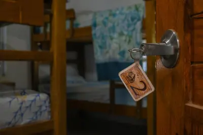 a lock on a door in a room with bunk beds at L' Europe in Isla Fuerte