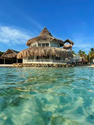 a resort on a beach with the water at Quinta del Mar Crystal Beach in Tintipan Island