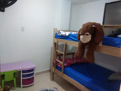 a bedroom with a bunk bed with a stuffed animal at Encantadora casa con ambiente guajiro 2 in Barranquilla