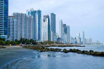 a view of a city with a beach and buildings at Loft in front of the sea MR1-1G neighbourhood strato alto in Cartagena de Indias