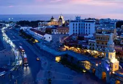 a city at night with lights on a street at Loft in front of the sea MR1-1G neighbourhood strato alto in Cartagena de Indias