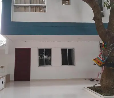 a building with a blue and white stripe on it at Apartaestudio Cartagena in Cartagena de Indias