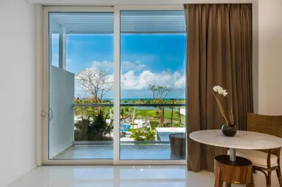 a room with a large window with a table and a view at Dreams Karibana Cartagena Golf & Spa Resort in Cartagena de Indias