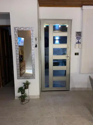 a door with a mirror next to a room at Jamadis in Tolú