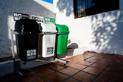 a couple of trash cans sitting next to a building at ORESCA Hostel in Cartagena de Indias
