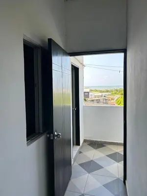 an open door to a room with a balcony at Amiri in Puerto Colombia
