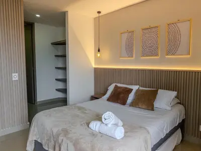 a bedroom with a bed with towels on it at Oceanview Escape Pool, Jacuzzi & Gym in Bocagrande in Cartagena de Indias