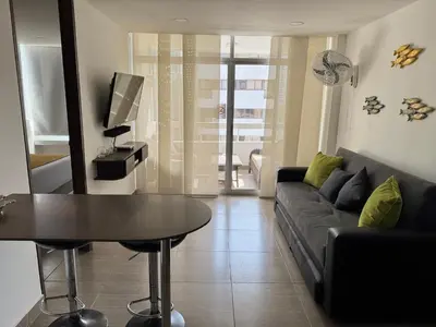 a living room with a couch and a table at Polanco Residences Tocagua Cartagena - Colombia in Cartagena de Indias