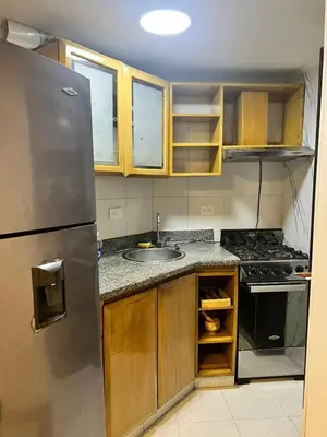 a kitchen with a stainless steel refrigerator and a sink at Espetacular vista mar y playa in Cartagena de Indias
