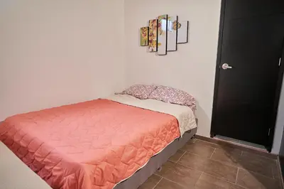 a small bed in a room with at Passarela Hospedaje in Cartagena de Indias