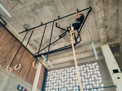 a person on a rope hanging from a ceiling at BREES in Santa Veronica