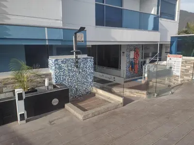 a building with a water fountain in front of it at APARTAMENTO BELLO HORIZONTE in Santa Marta