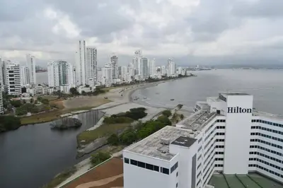 a view of a city with a river and buildings at APARTAMENTO CON VISTA AL MAR CARIBE PISO 19 - Espectacular in Cartagena de Indias