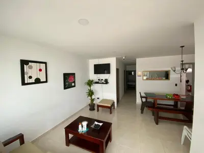 a living room with a table and a couch at Cabaña la Isla-Coveñas in Coveñas