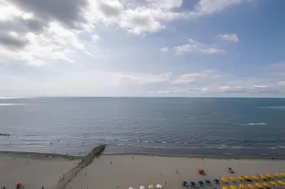 a view of the beach with chairs and the ocean at Laurdhomes Palmetto Beach Sea View, for working in Cartagena de Indias